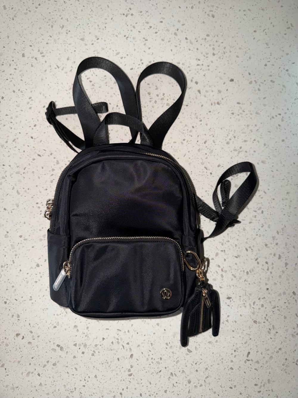 lululemon athletica Black Mini Backpack with Gold Hardware